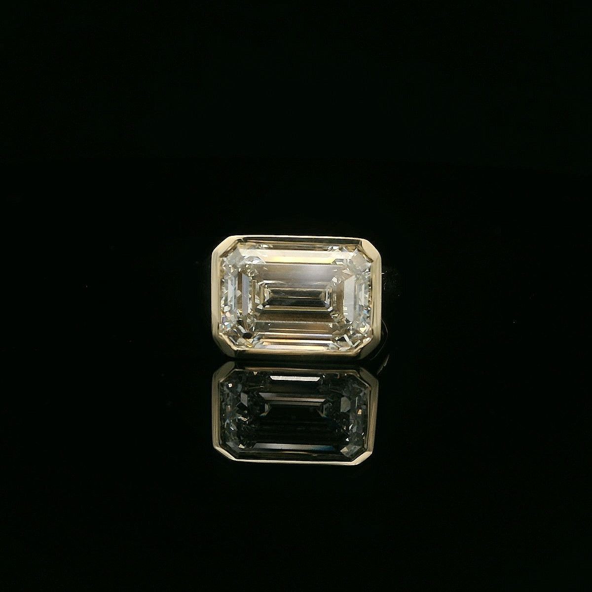 8 Carat East to West Bezel Set Emerald Cut Engagement Ring