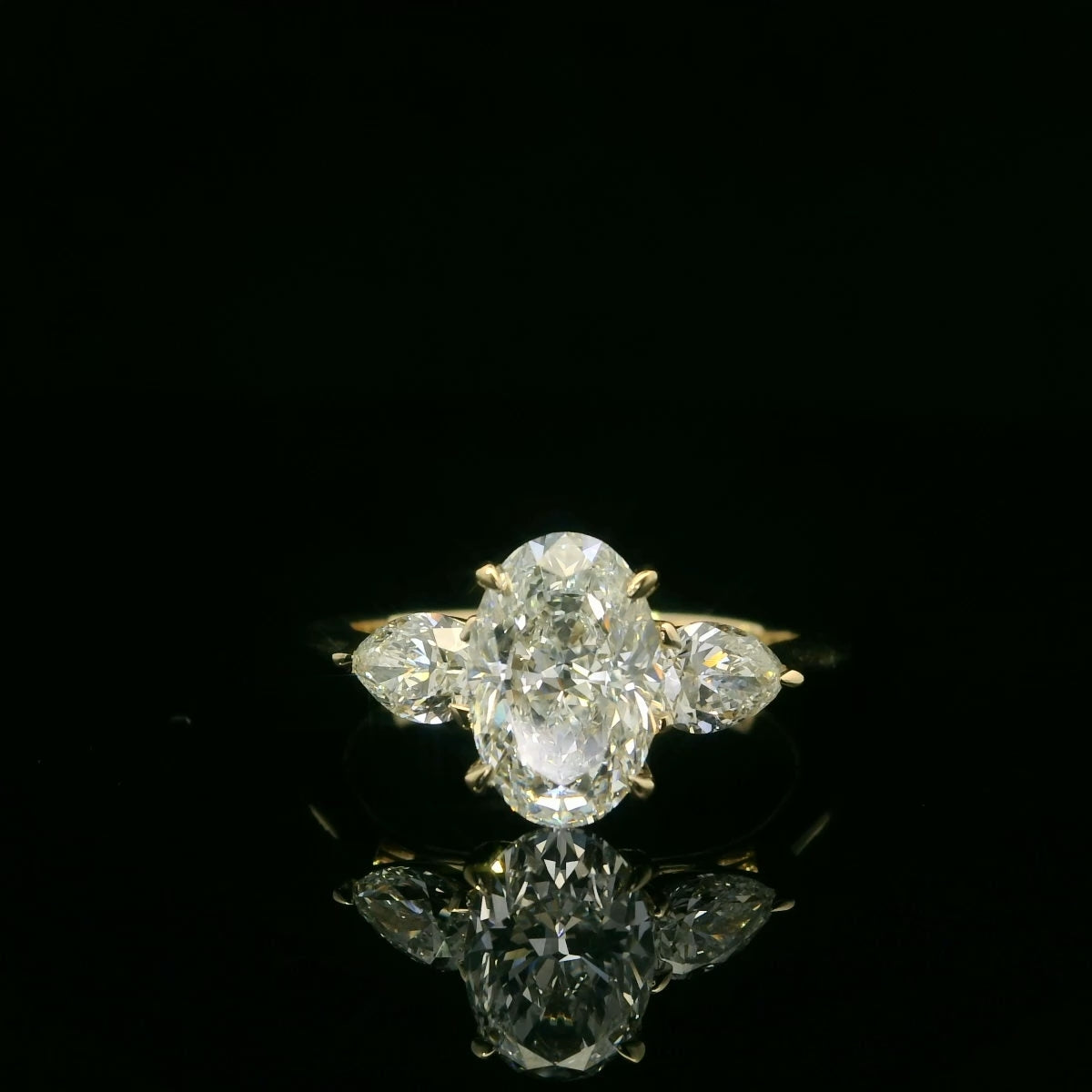 2 Carat Oval Cut with Pear Sidestones Engagement Ring