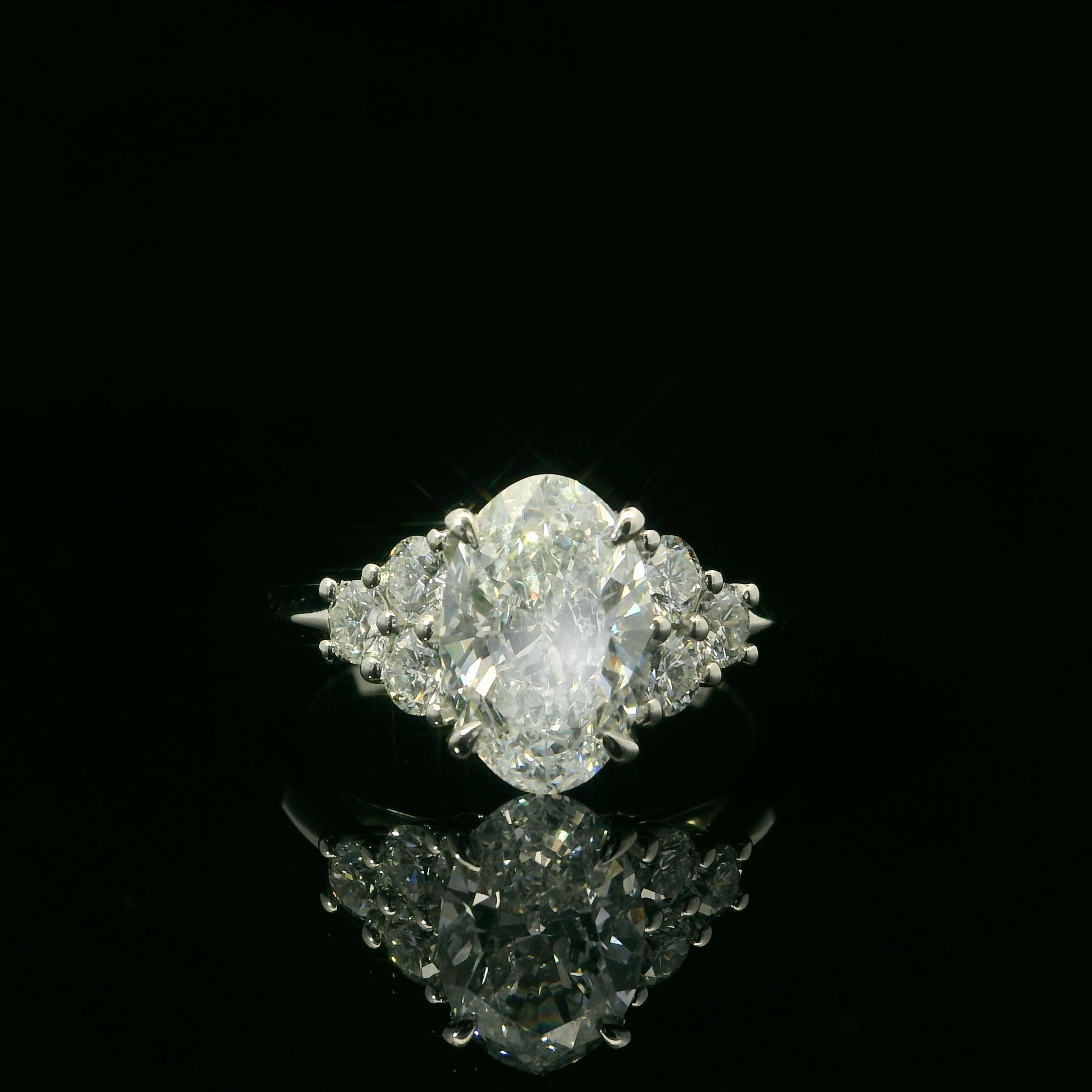 3 Carat Oval Cut with Round Sidestones Engagement Ring